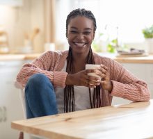 Young woman drinking coffee for benefits of caffeine consumption